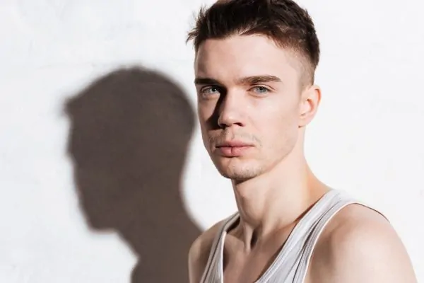 Man with defined facial features and strong jawline profile illustrating potential results of dermal filler jaw enhancement