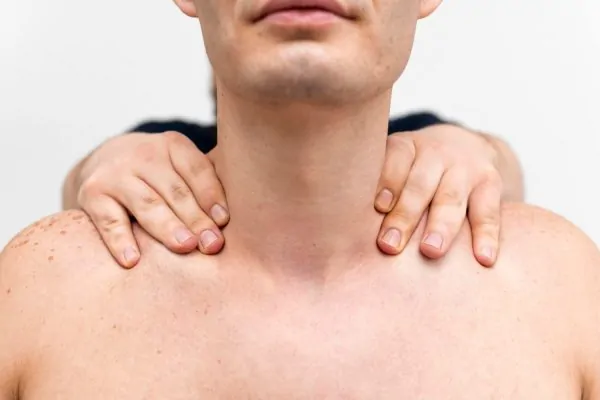 Man's neck at initial assessment for non-invasive tightening treatment