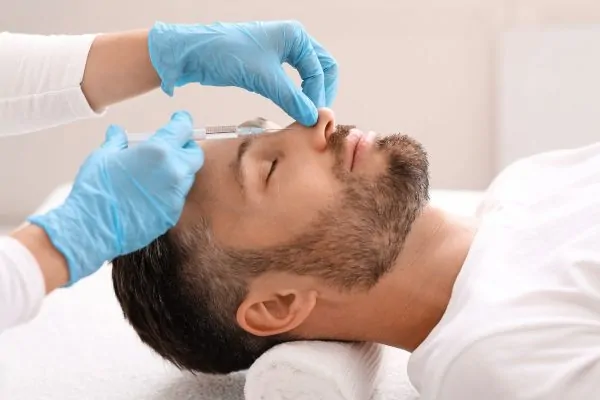 Men who have undergone a plastic surgery procedure for facial rejuvenation