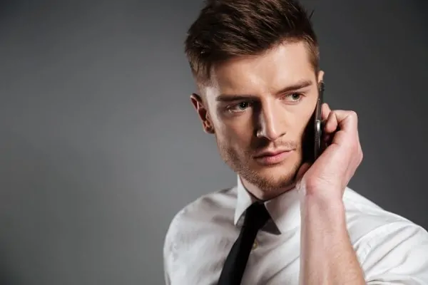 Professional man displaying enhanced jawline contours from dermal filler treatment