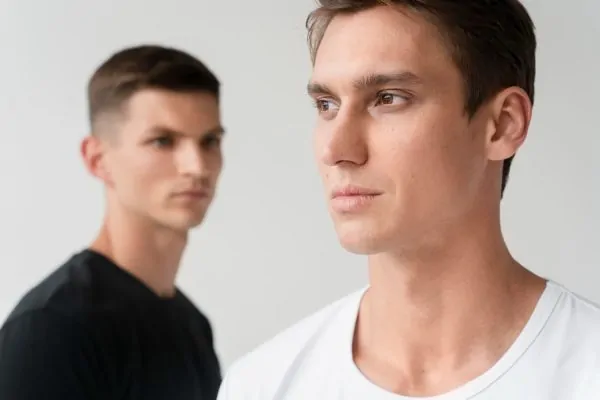 Two men showing defined jawlines representing ideal candidates for PDO thread lift treatment