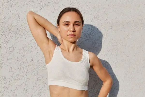 athletic showing her armpit