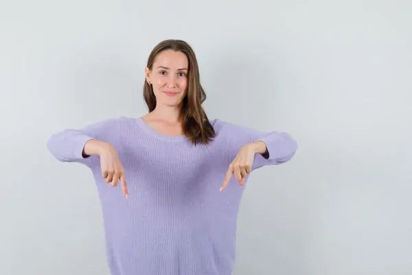 beautiful woman pointing down