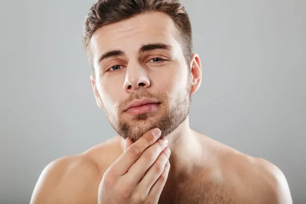 Close up beauty portrait of a young mans jawline