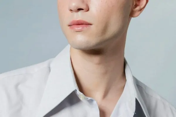 Close-up of man with opened button on shirt