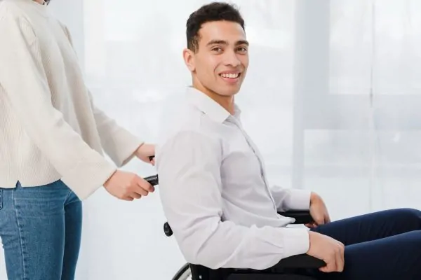 Close-up of a woman pushing the smiling young man