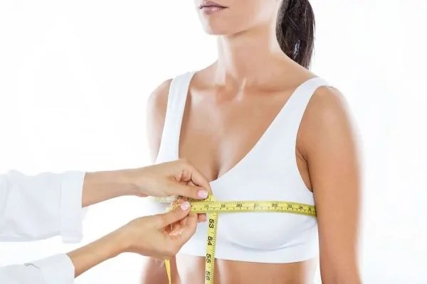 doctor-measuring-size-patients-breast