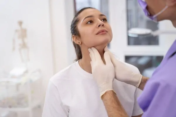 Doctor performing routine medical checkup