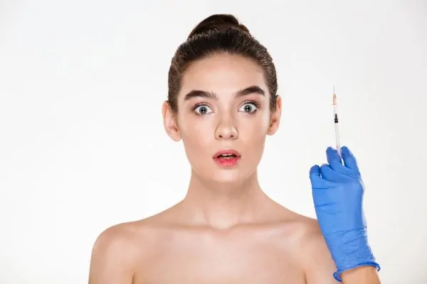 frightened woman preparing for injections