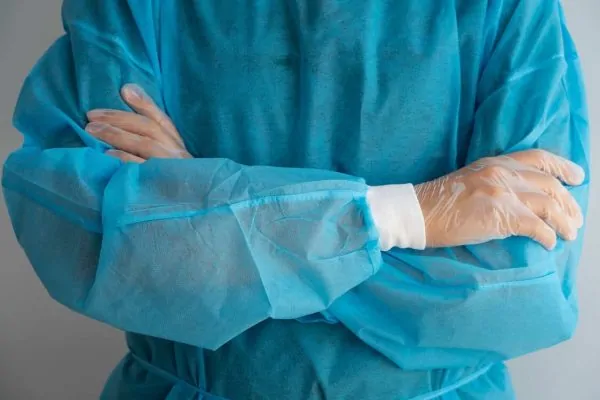 Front view doctor wearing medical gown