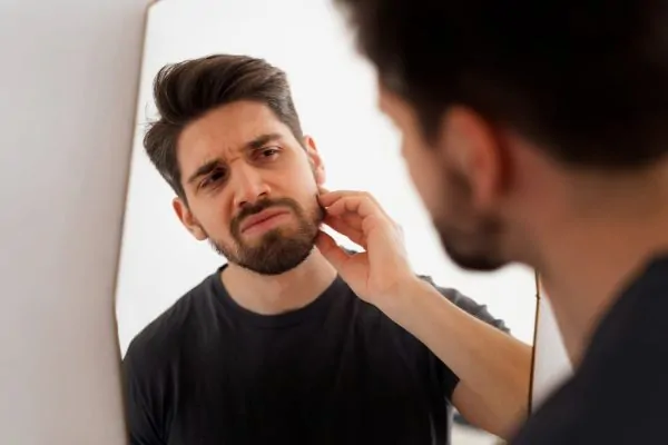 man looking in the mirror