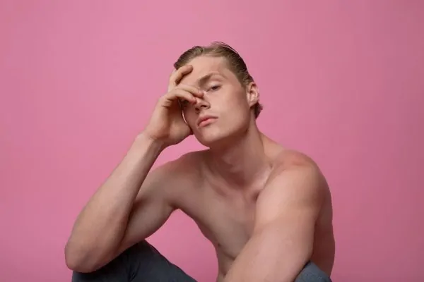 Man posing with pink background