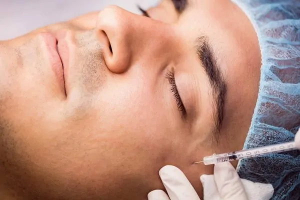 Man receiving Cosmetic Surgery Procedures on his face