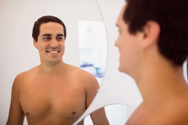 Man smiling satisfies with his Plastic Surgery result