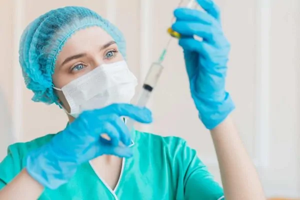Nurse with syringe anesthesia