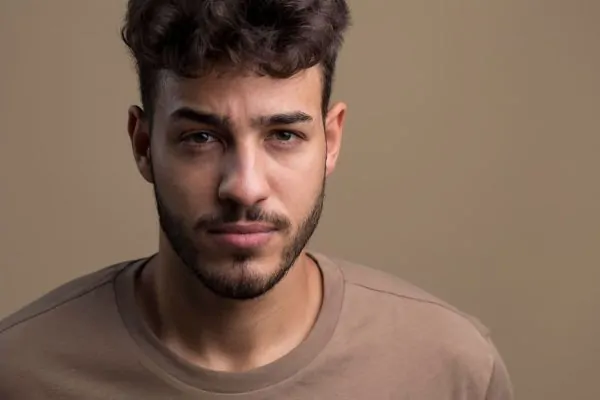 Portrait of handsome serious man facetite treatment