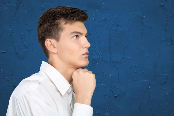 Portrait of handsome young showing jawline