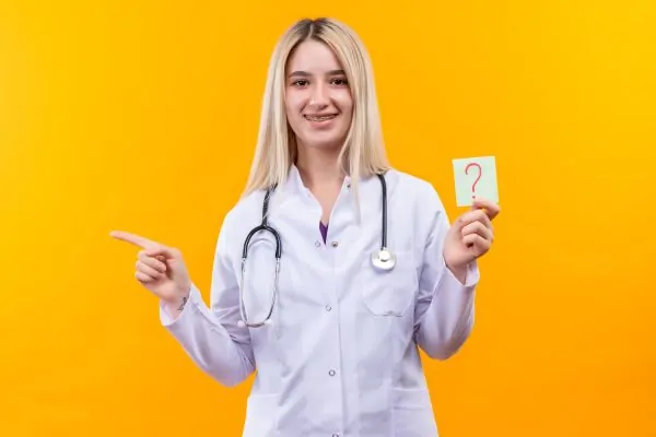 Smiling doctor young girl wearing stethoscope