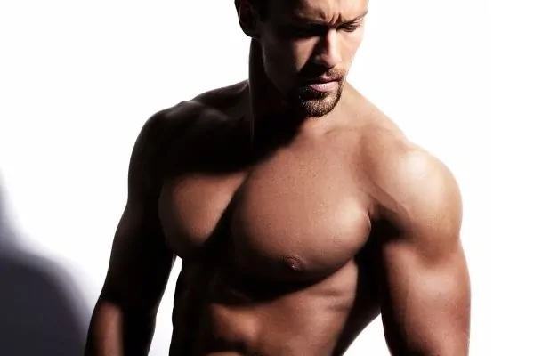Strong shirtless man posing result to liposuction