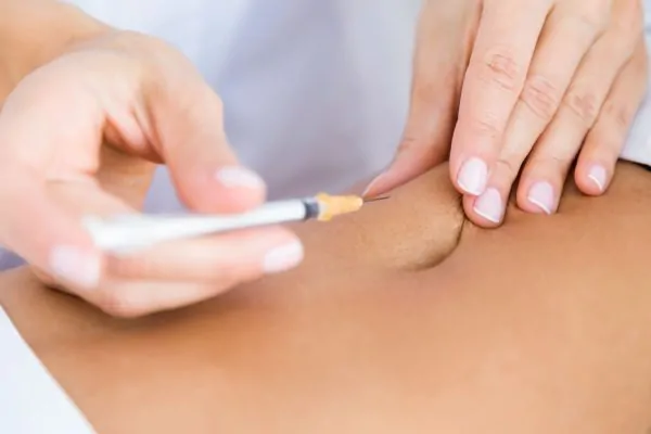 Surgeon making Liposuction Scars treatment