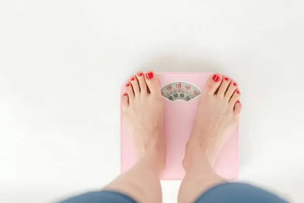 A woman tracking her weight loss