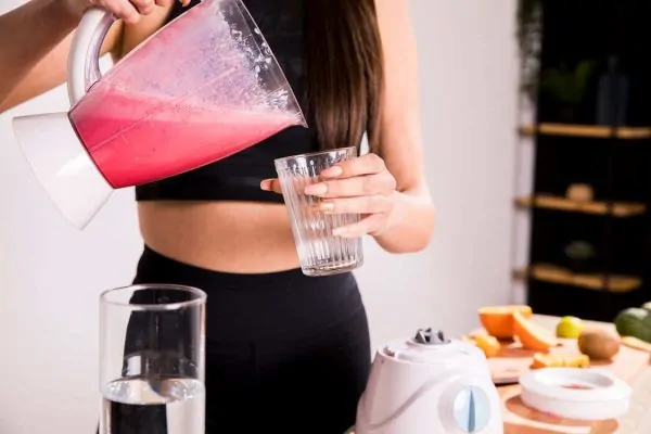 woman preparing a healthy juice