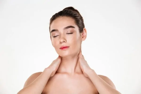 Young lady with hair in bun and clean skin