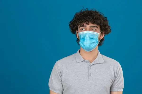 Young man in medical protective mask