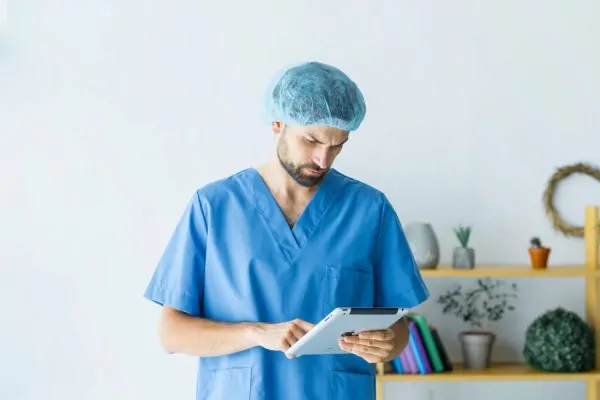 Young surgeon checking patients for liposuction